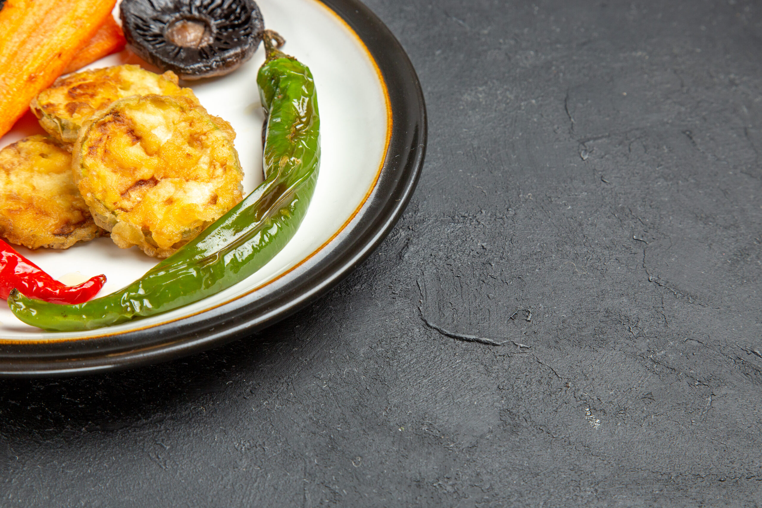 side-close-up-view-roasted-vegetables-plate-appetizing-roasted-mushrooms-hot-peppers