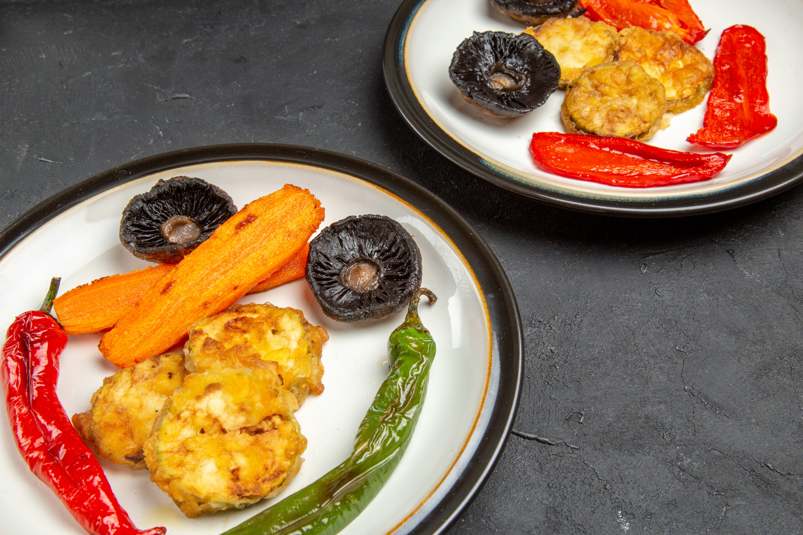 side-close-up-view-vegetables-two-plates-roasted-vegetables-table
