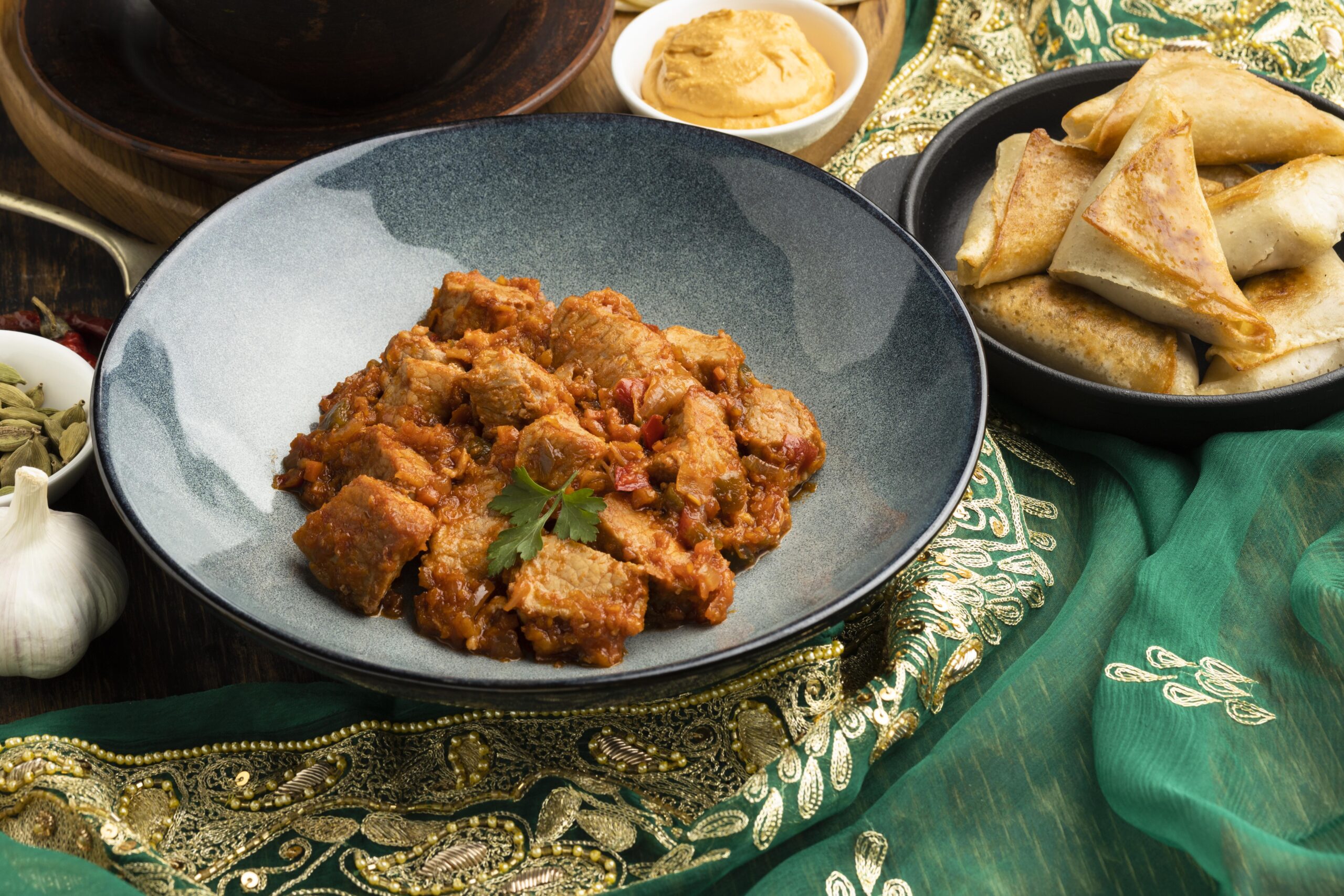 indian-food-arrangement-with-sari-high-angle