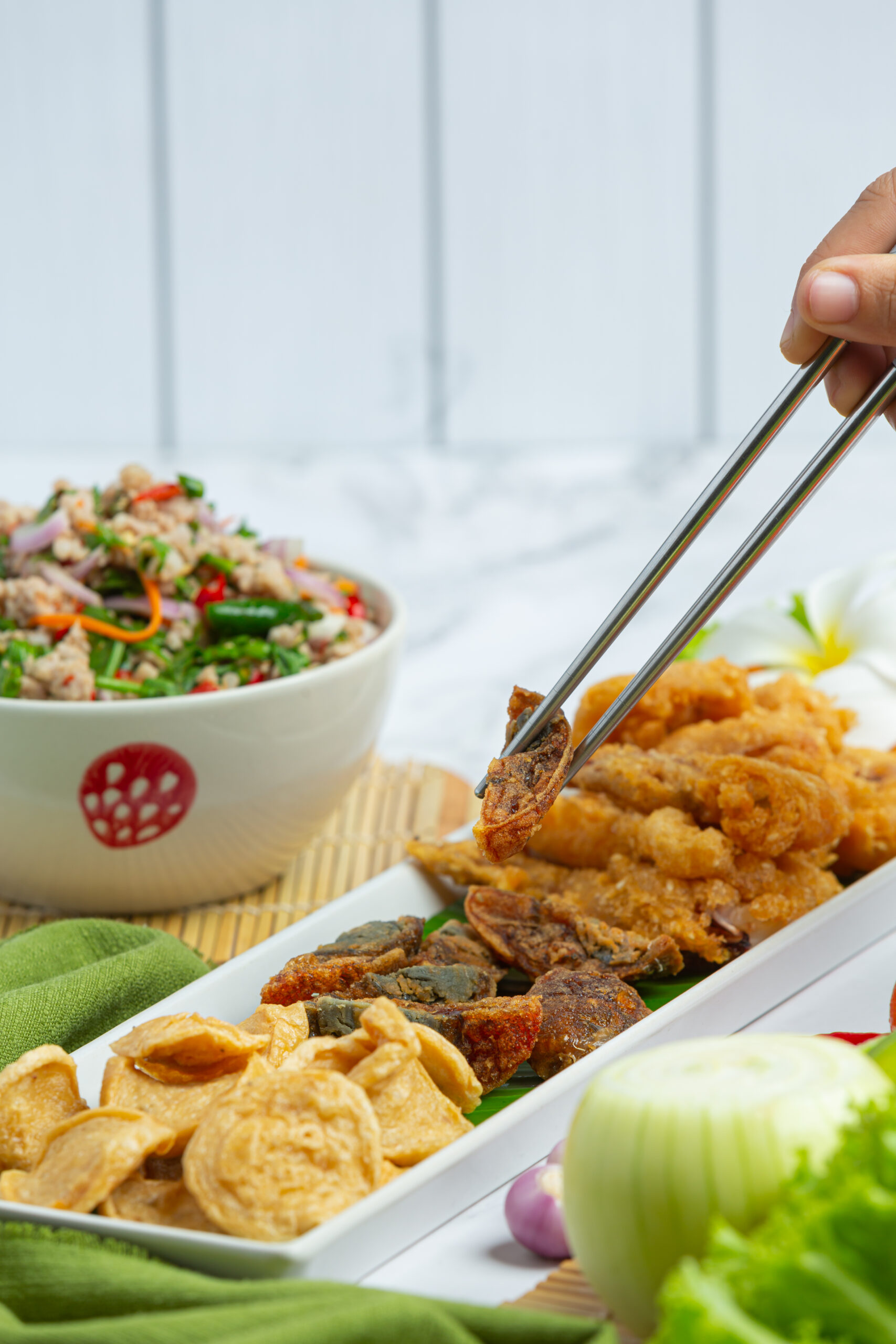Mixed Spicy Salad with Vietnamese Sausage, Preserved Egg and Crispy Squid, Thai Food.